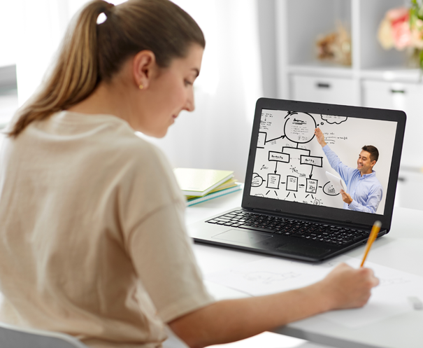 Person sitting at desk using a laptop
